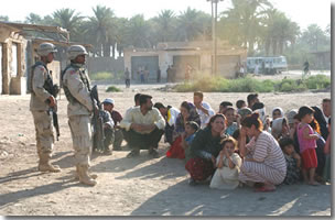 Village families after homes are bombed